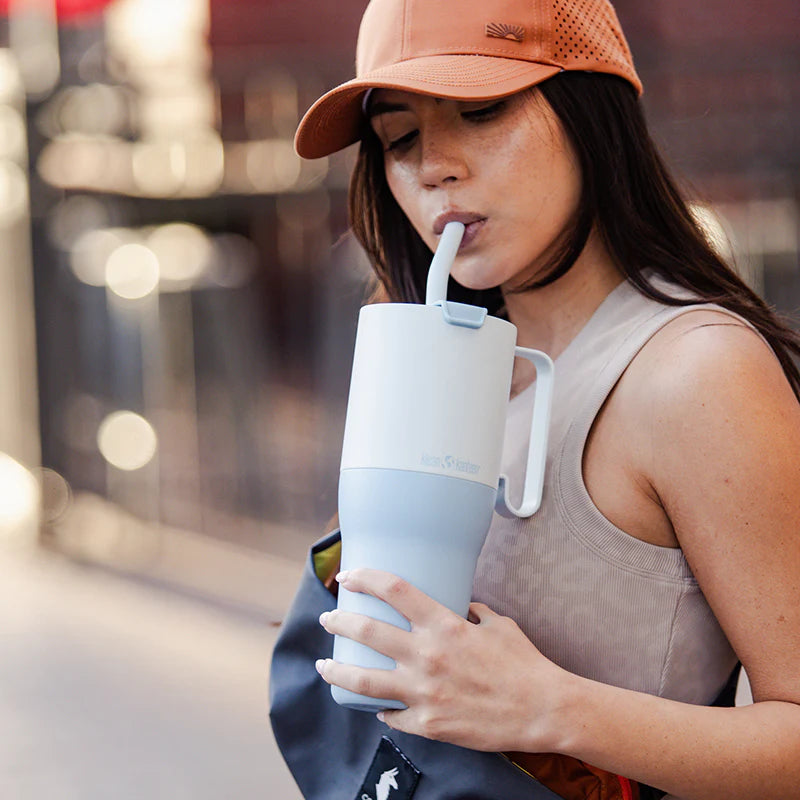 Ice blue 36 ounce water tumbler with flip lid and straw. 