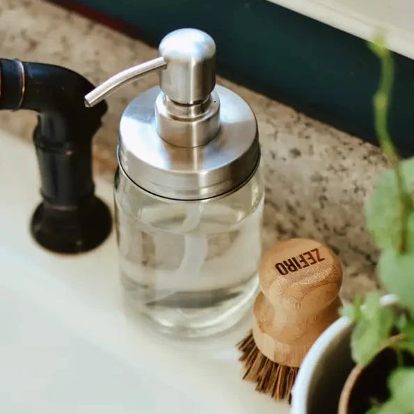 Metal mason jar pump lid jar on counter. 