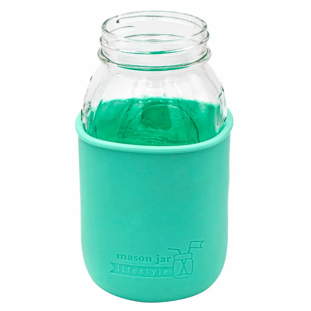 Glass jar with aquamarine colored jar cover. 