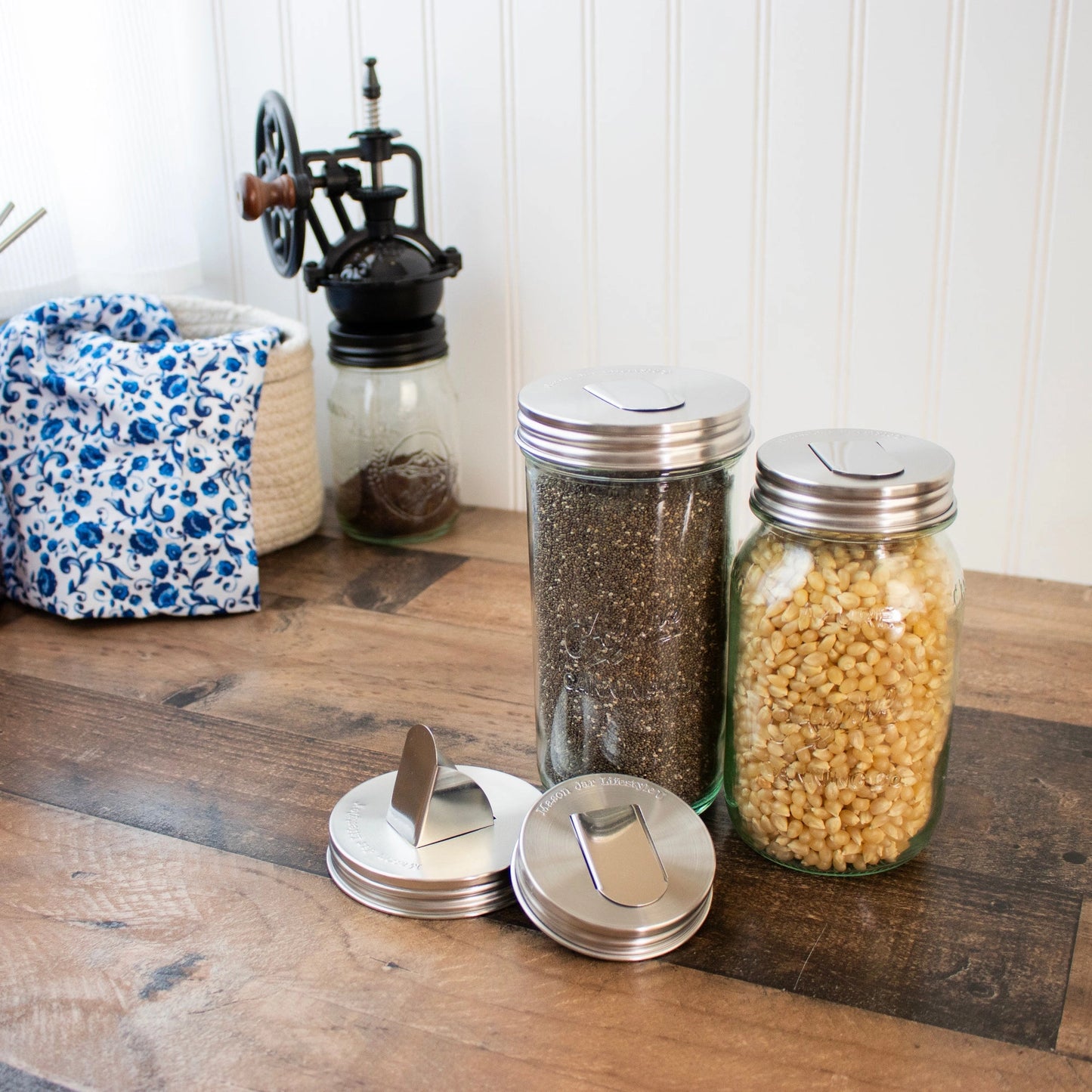 Wide mouth and regular mouth grain dispensers on jars.