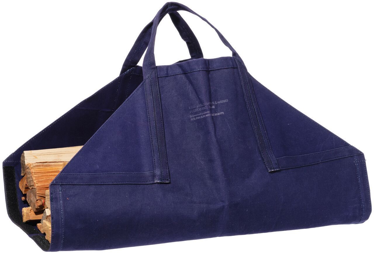 Navy blue canvas firewood carrier with wooden logs on a white background